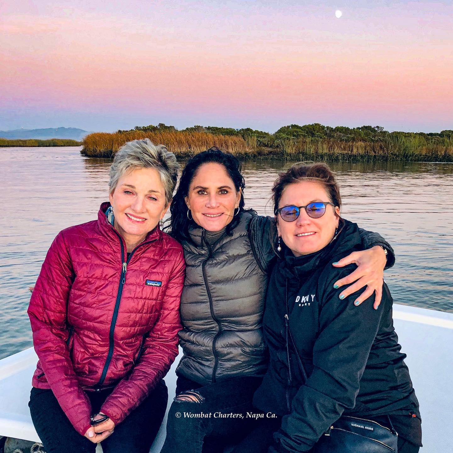 Friends take a relaxing boat tour on the Napa River.