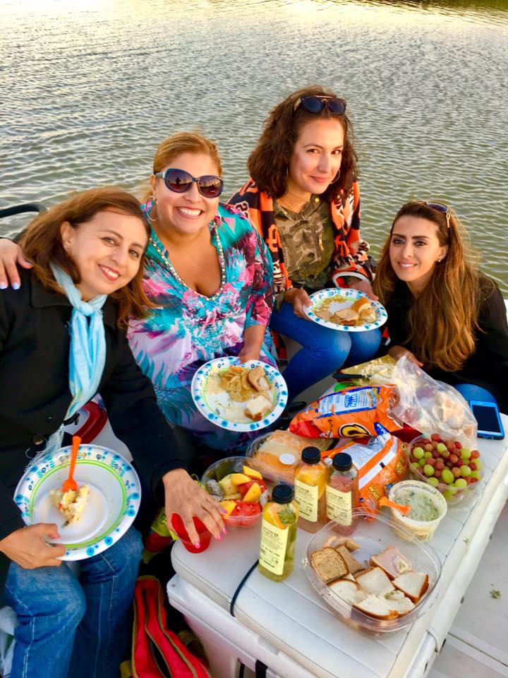 Friends sharing a meal on a Napa River Sunset Cruise.