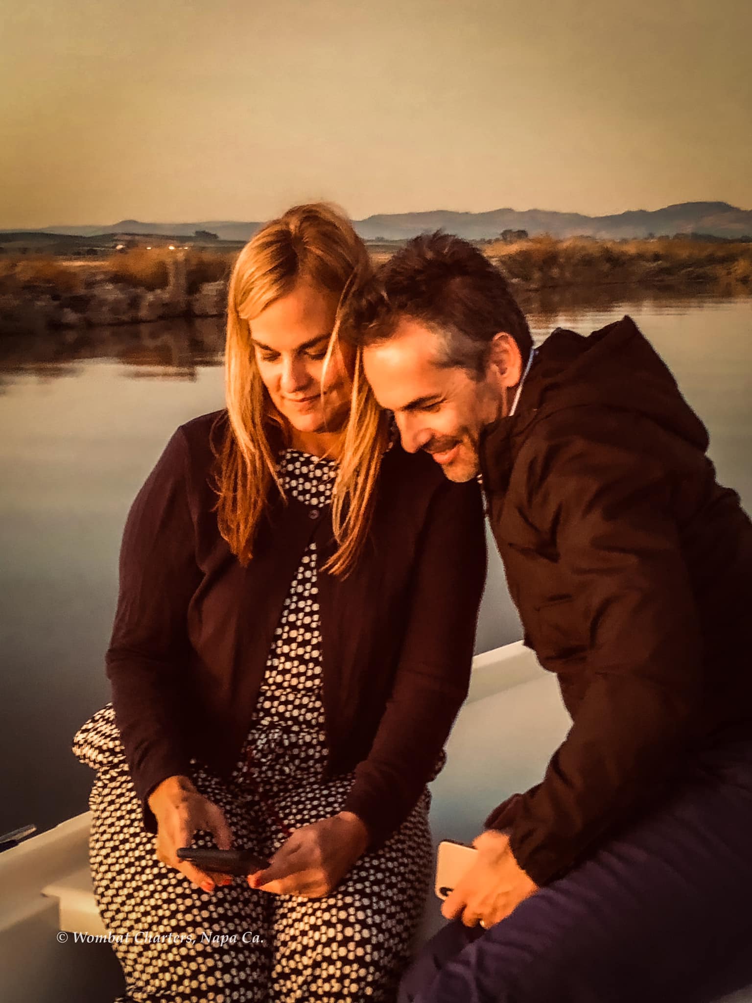 A couple having a relaxing time on a Napa River boat tour.